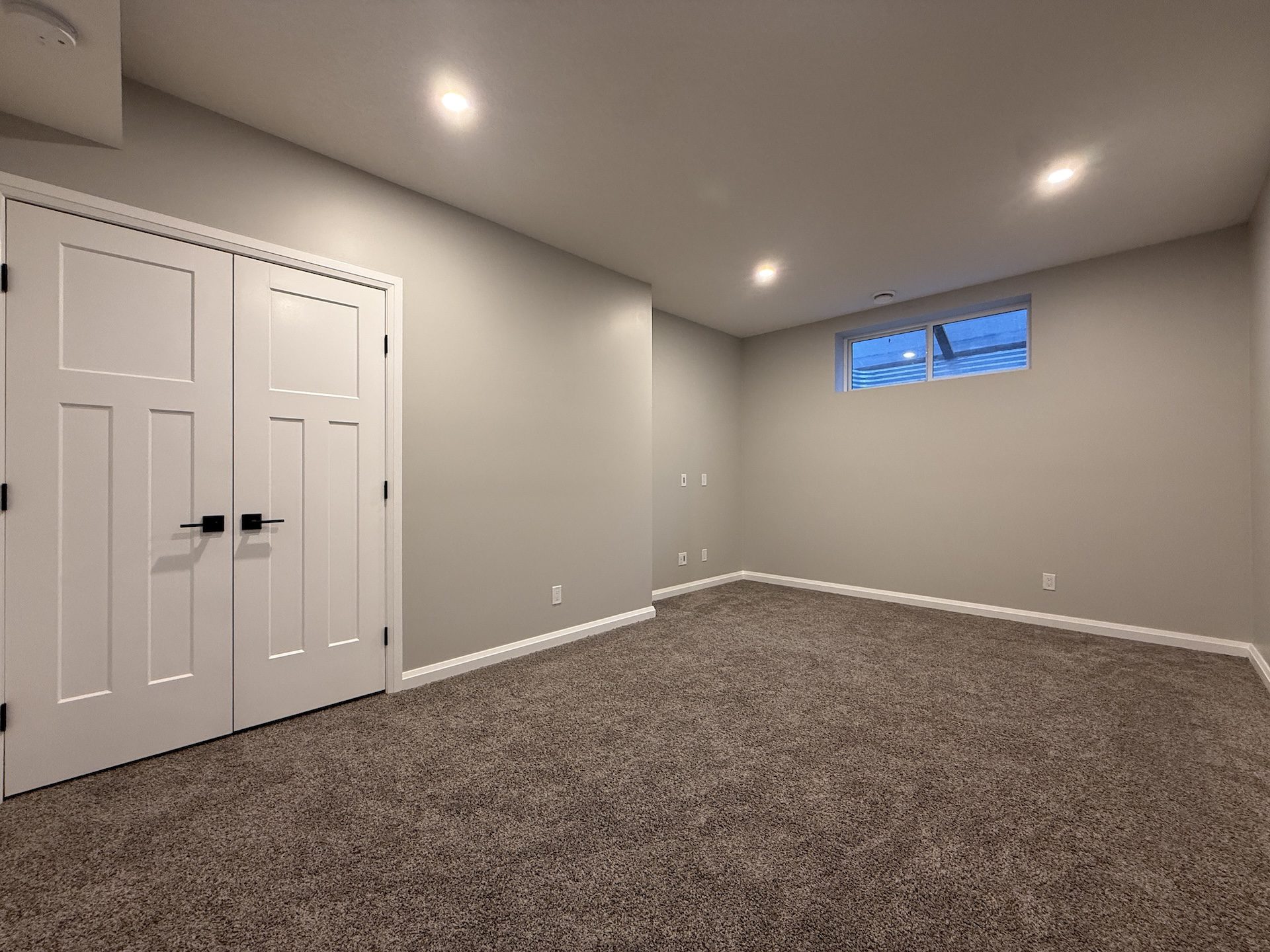 Bedroom + guest space in a finished Calgary basement