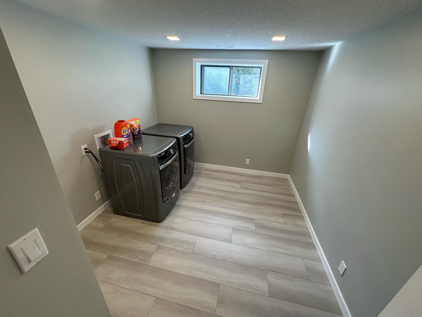 Basement laundry in a finished Calgary basement